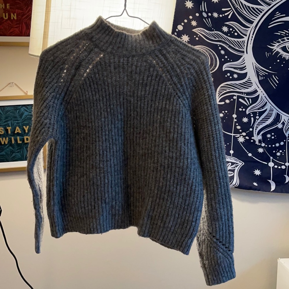 Woman’s gray sweater